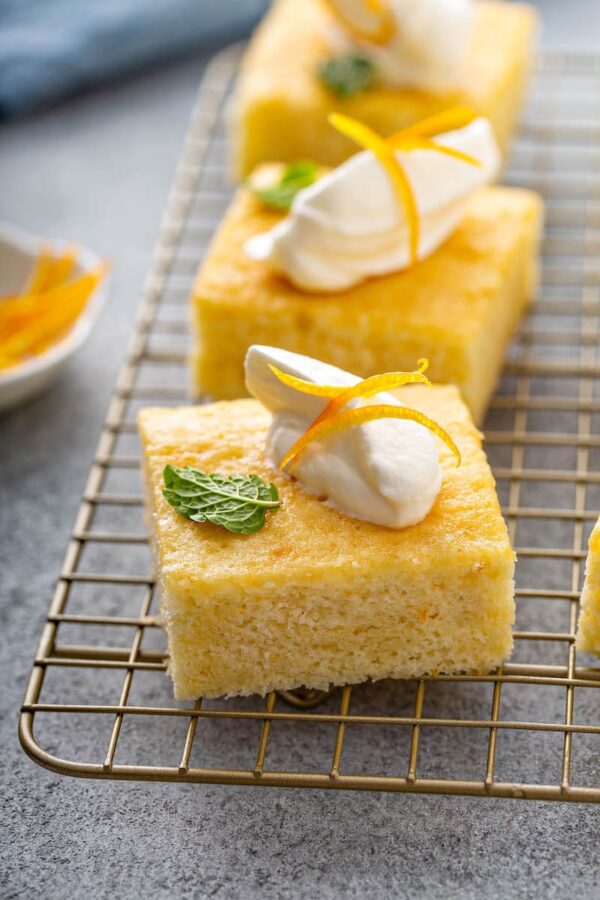 Orange Coconut Cake on a cooling rack.