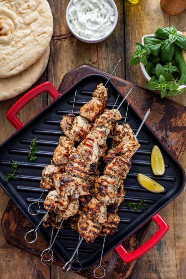 Grilled marinated chicken on skewers.