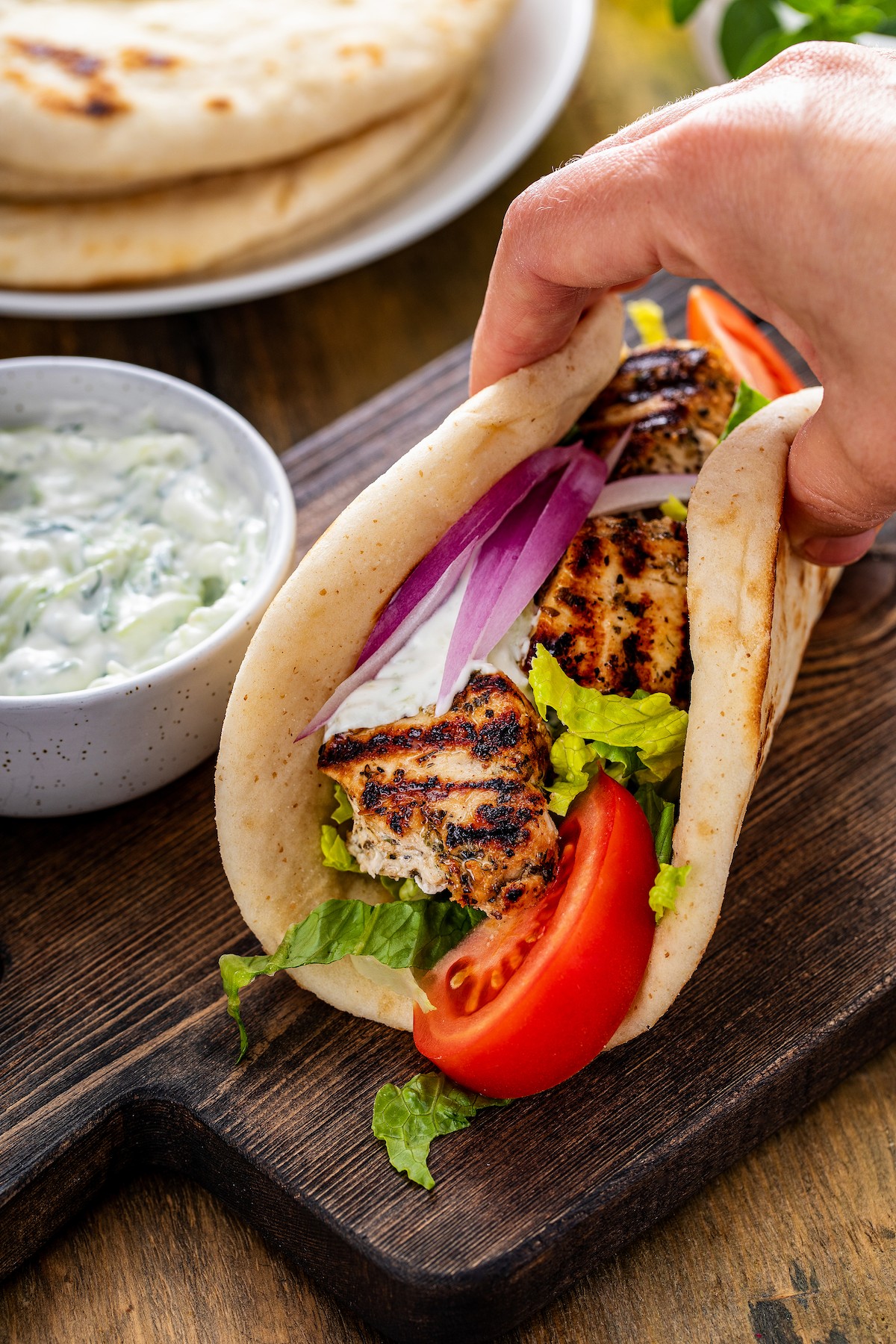 Grilled chicken, red onion, and tomato wrapped in pita bread.