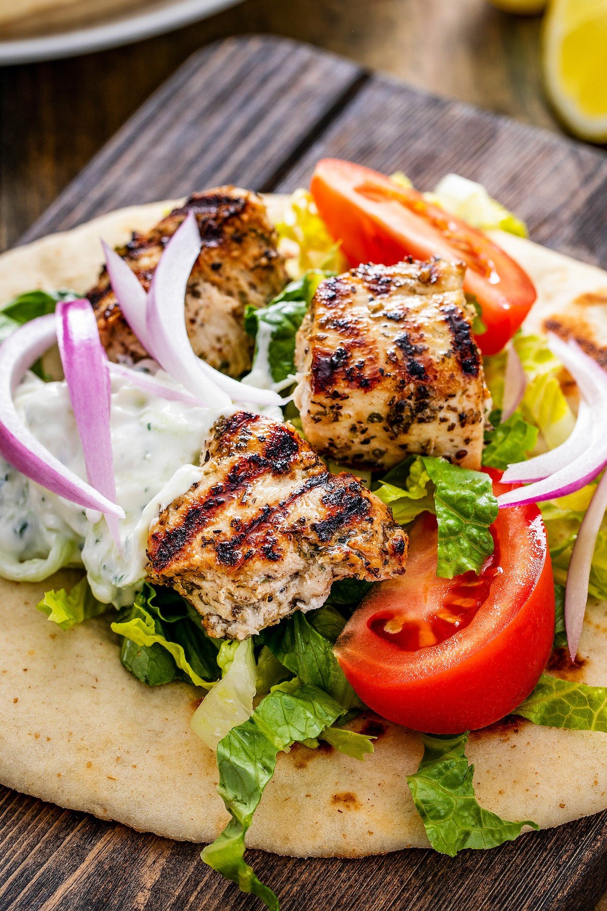 Grilled chicken with Greek seasoning on pita bread.