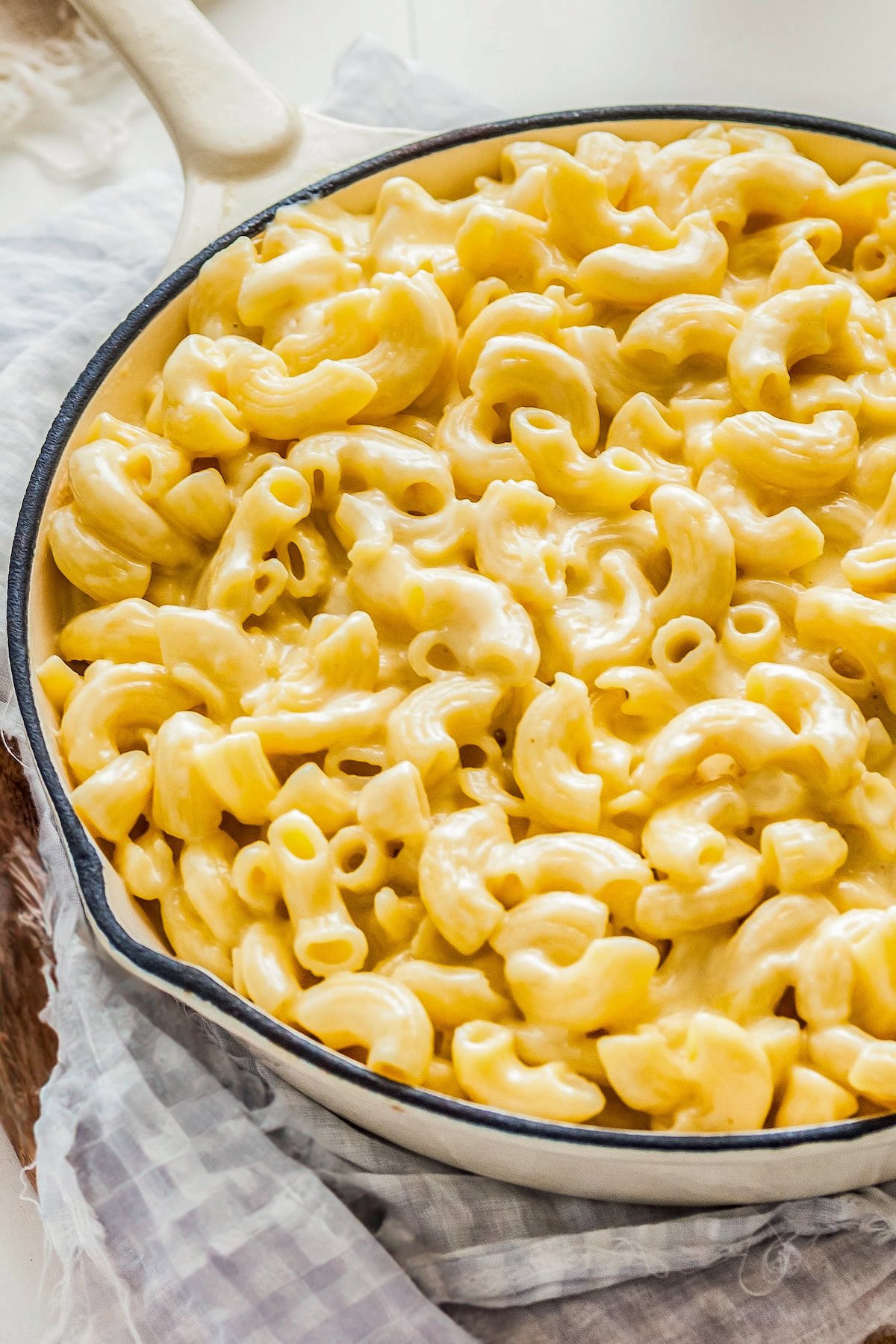 A pan is filled with creamy homemade mac and cheese. 