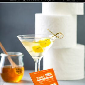 Photo of a Immune boosting Quarantini in a Martini Glass with toilet paper in the background.