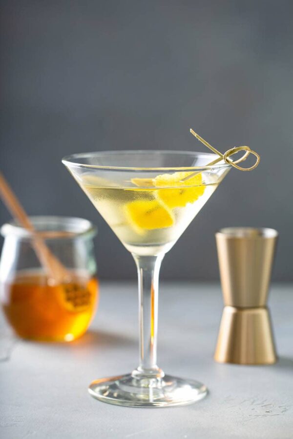 Martini with lemon and honey inside glass