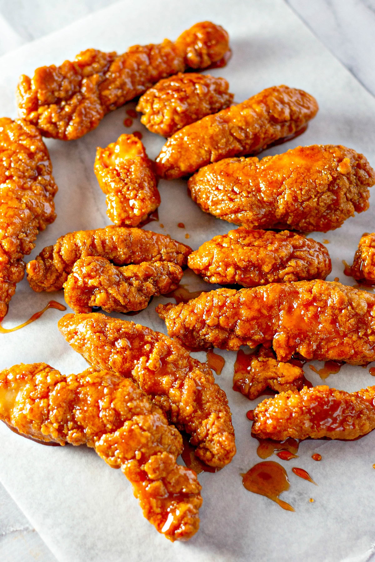 Spicy bbq sauce fully coats crispy chicken tenders. 