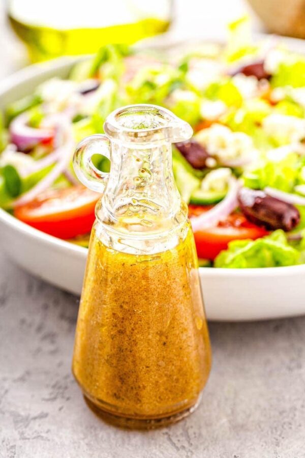 Greek Salad Dressing in a glass bottle.