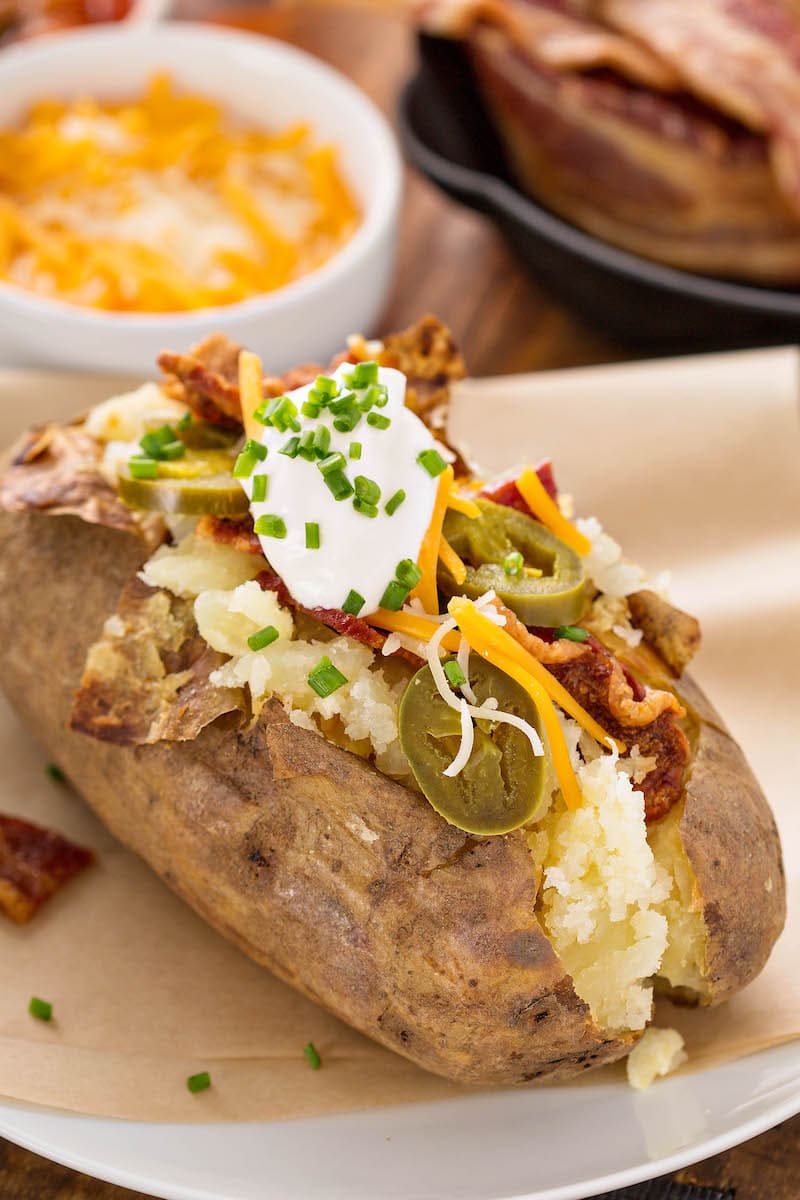 Baked Potato in air fryer filled with toppings. 