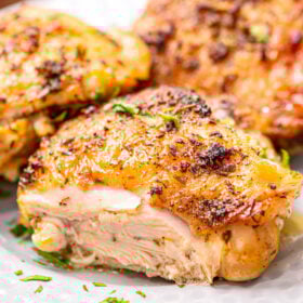 A baked chicken breasts, cut into to show doneness.