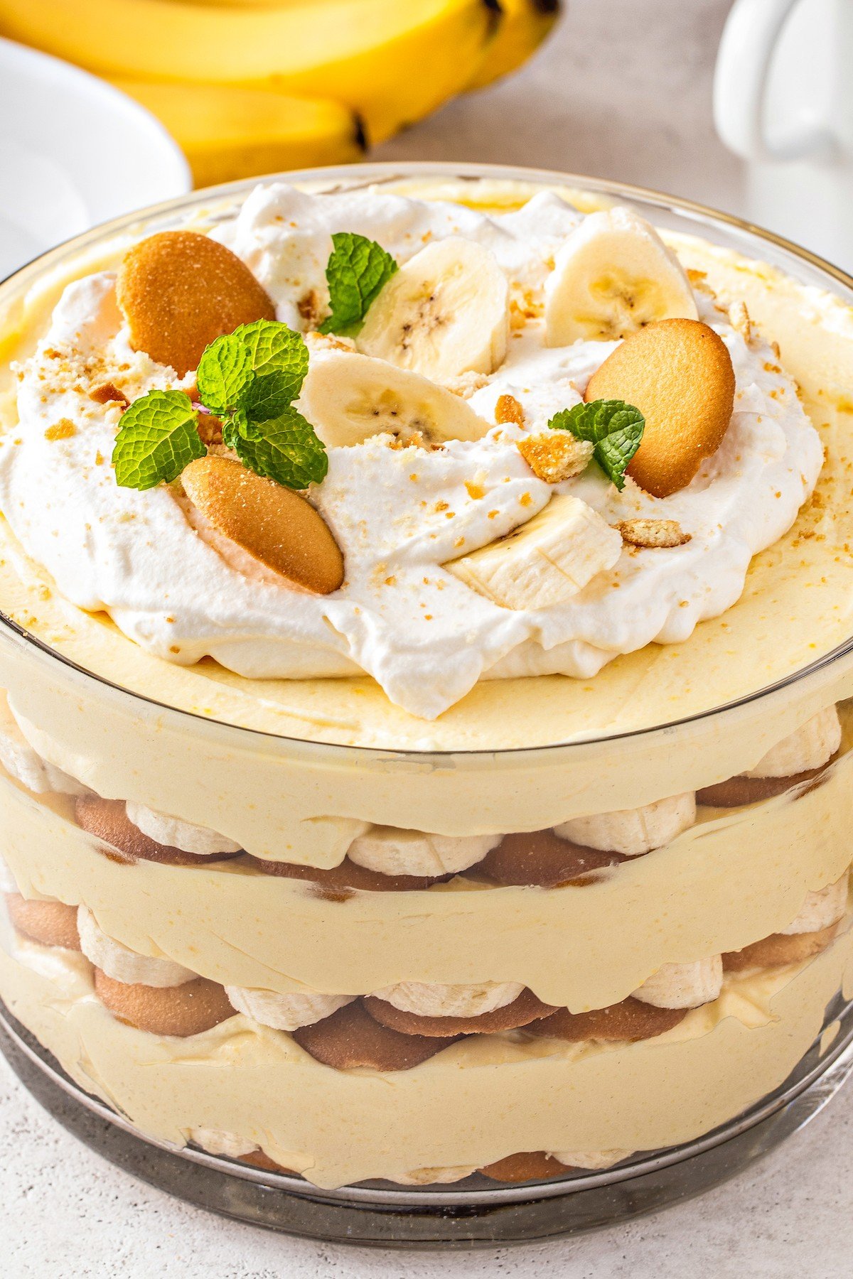 Homemade banana pudding in a glass dish showing off the layers