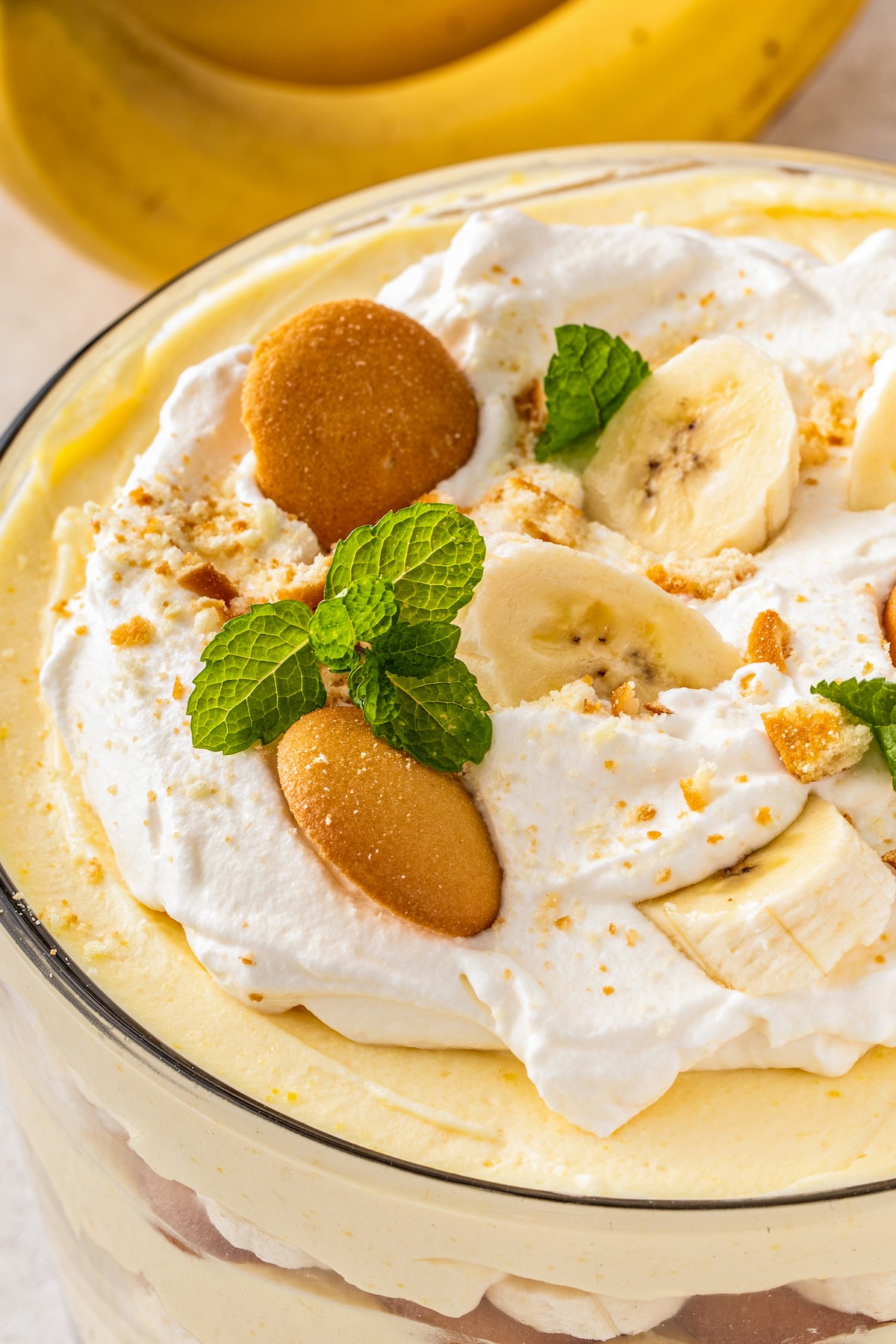 Close up of the top of easy banana pudding with whipped topping and nilla wafers