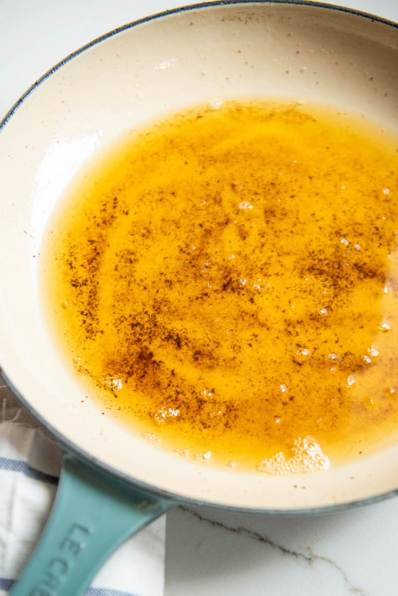 Up close image of brown butter in a skillet.