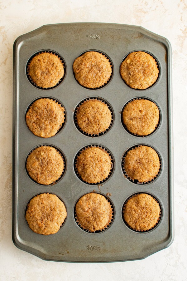 Baked cupcakes in a muffin tin.