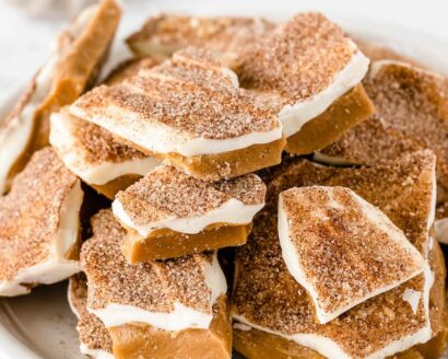 Cinnamon sugar toffee on a white plate with a napkin.