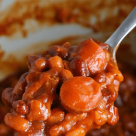 Pinterest image of pork and beans on a spoon with wording on top.