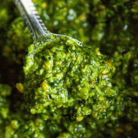 collage image for pinterest of basil pesto on a spoon