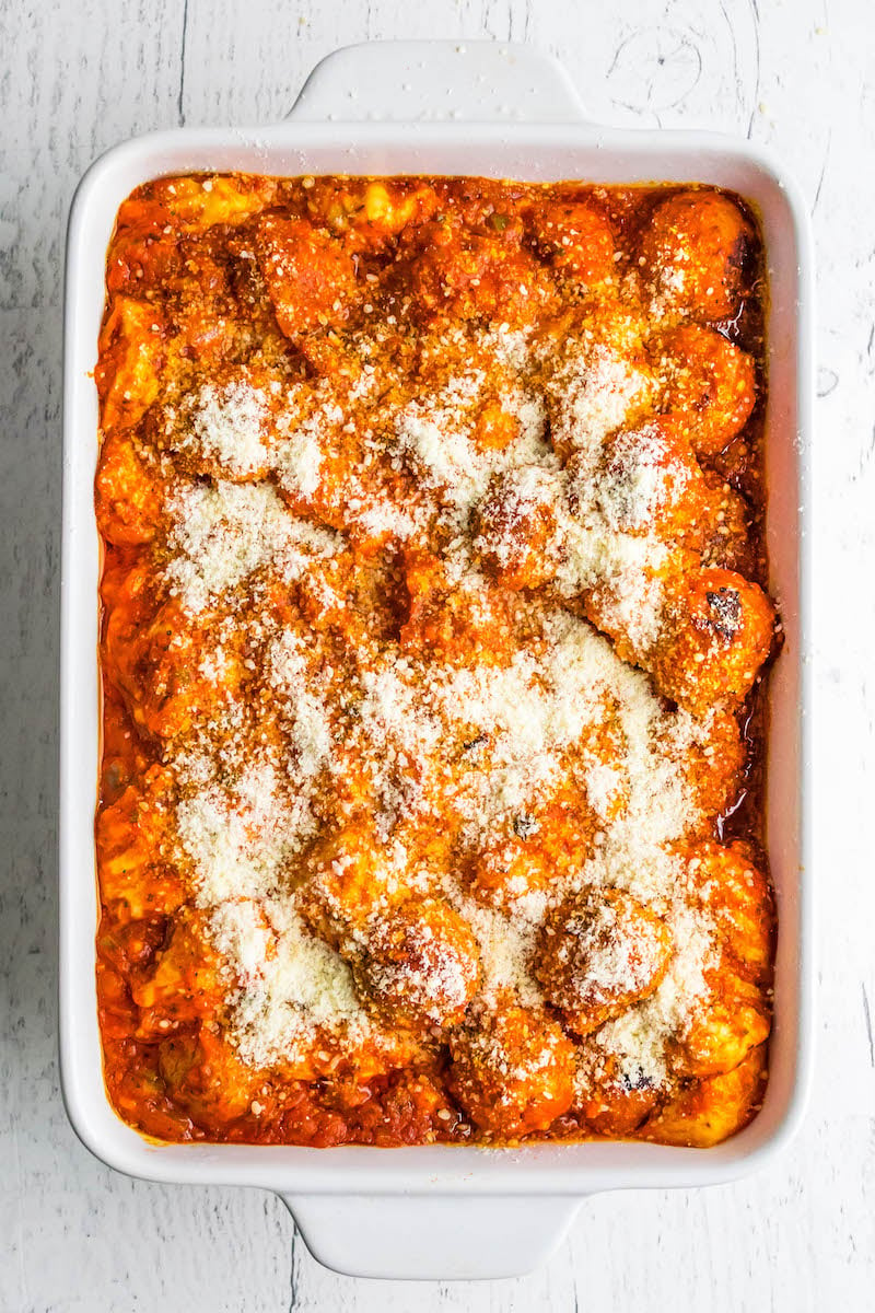 Pan of meatball sub casserole with cheese sprinkled on top.