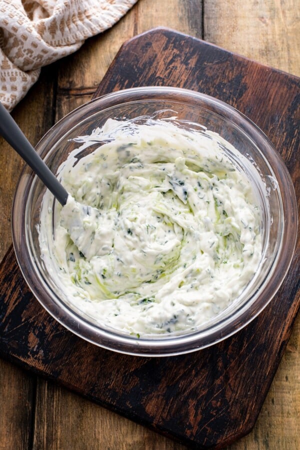Greek yogurt combined with olive oil, grated cucumber, and dill.