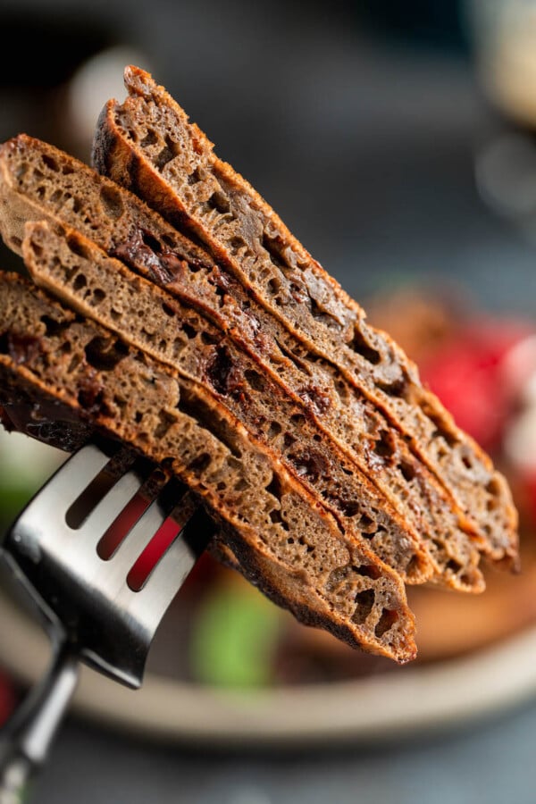 Up close image of sliced pancakes on a fork.