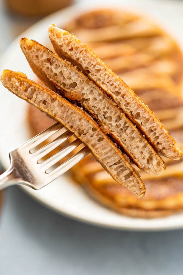 Up close image of three pieces of pancake on a fork.
