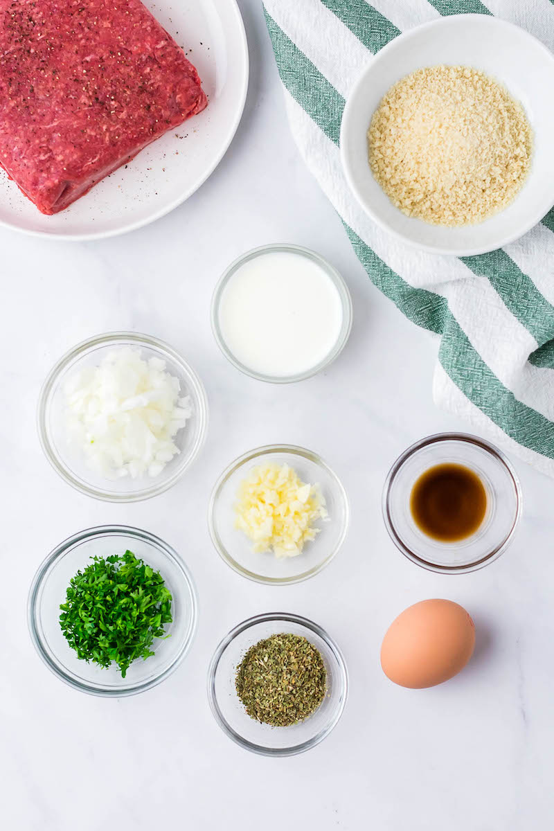 Ingredients for homemade meatballs in bowls.