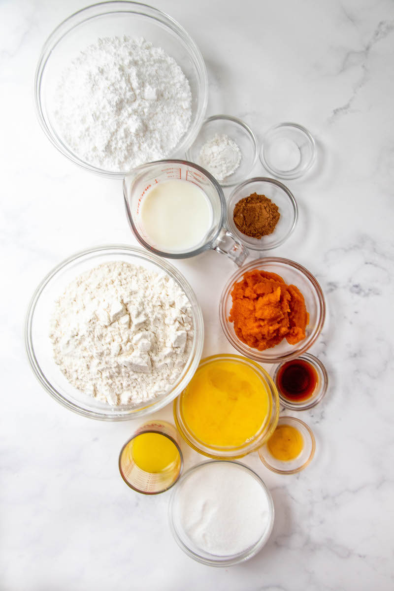 Maple glazed pumpkin donuts ingredients in bowls.