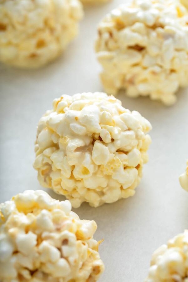 Popcorn treats are sitting on parchment paper