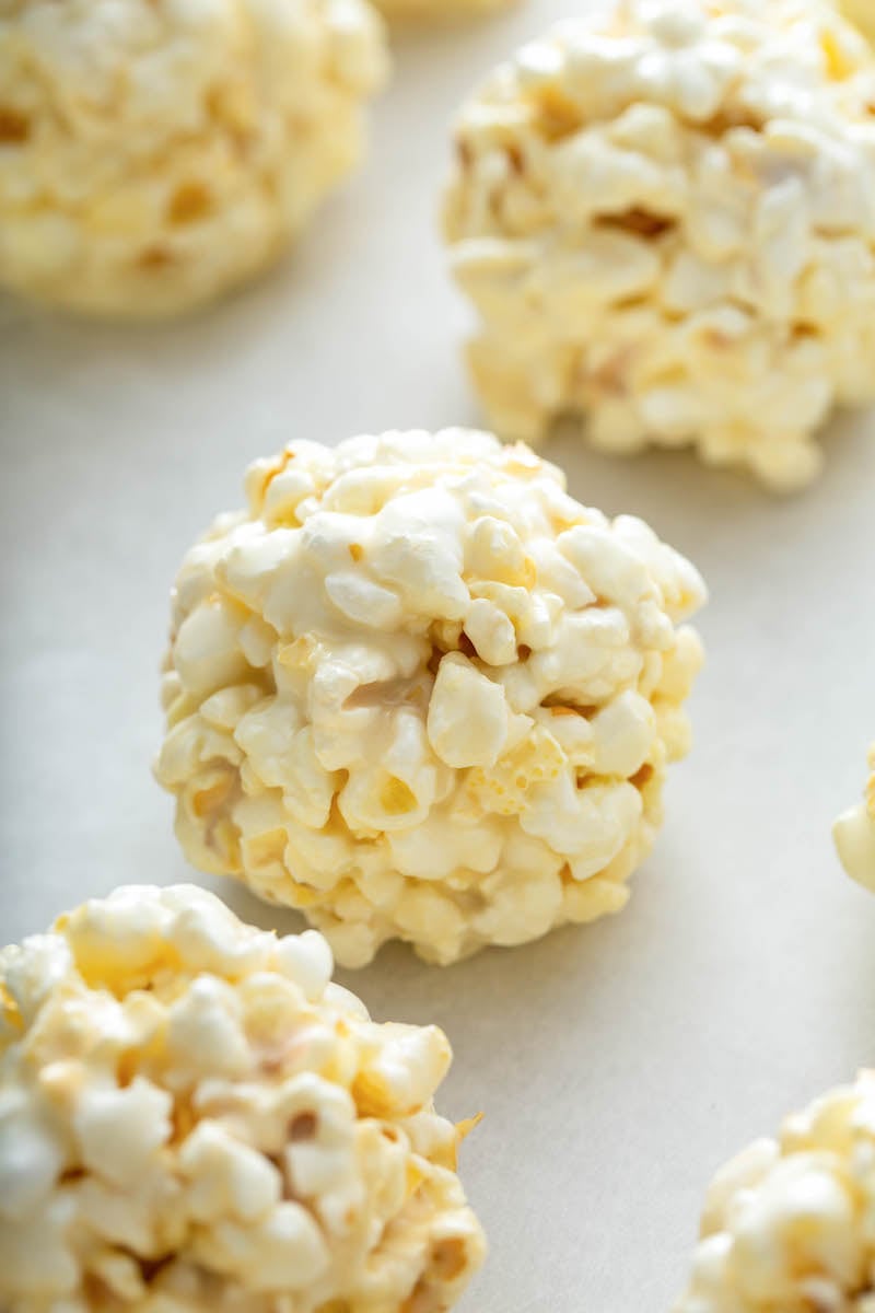 Popcorn treats are sitting on parchment paper