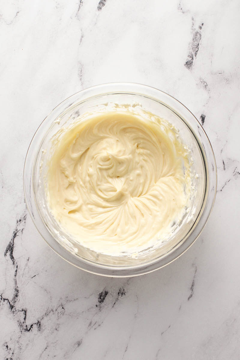 Cream cheese mixture in a glass bowl.