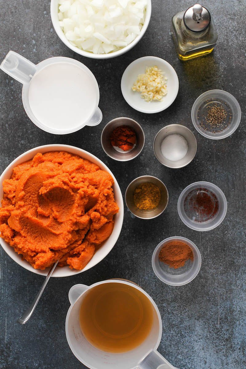 Pumpkin soup ingredients in bowls.