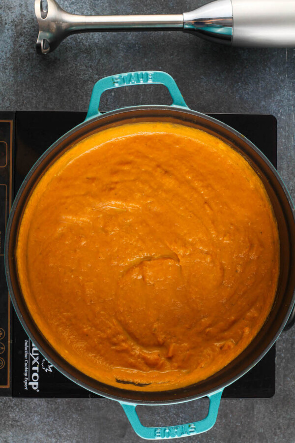 Pumpkin soup in a stock pot.