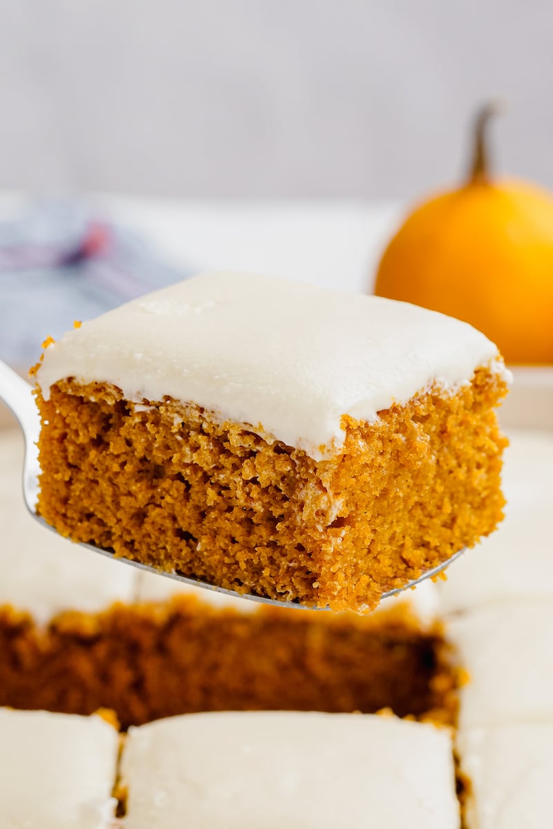 A pumpkin bar is held up with a utensil