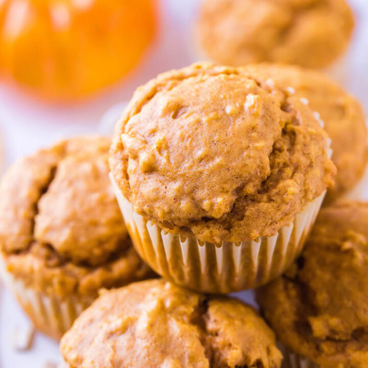 Plate of pumpkin muffins in wrappers.