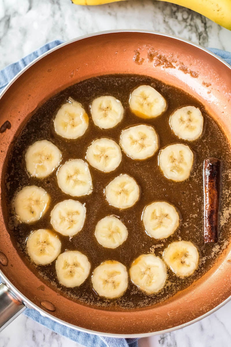 Banana slices in bananas foster sauce.