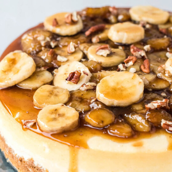 Bananas foster cheesecake topped with banana slices.