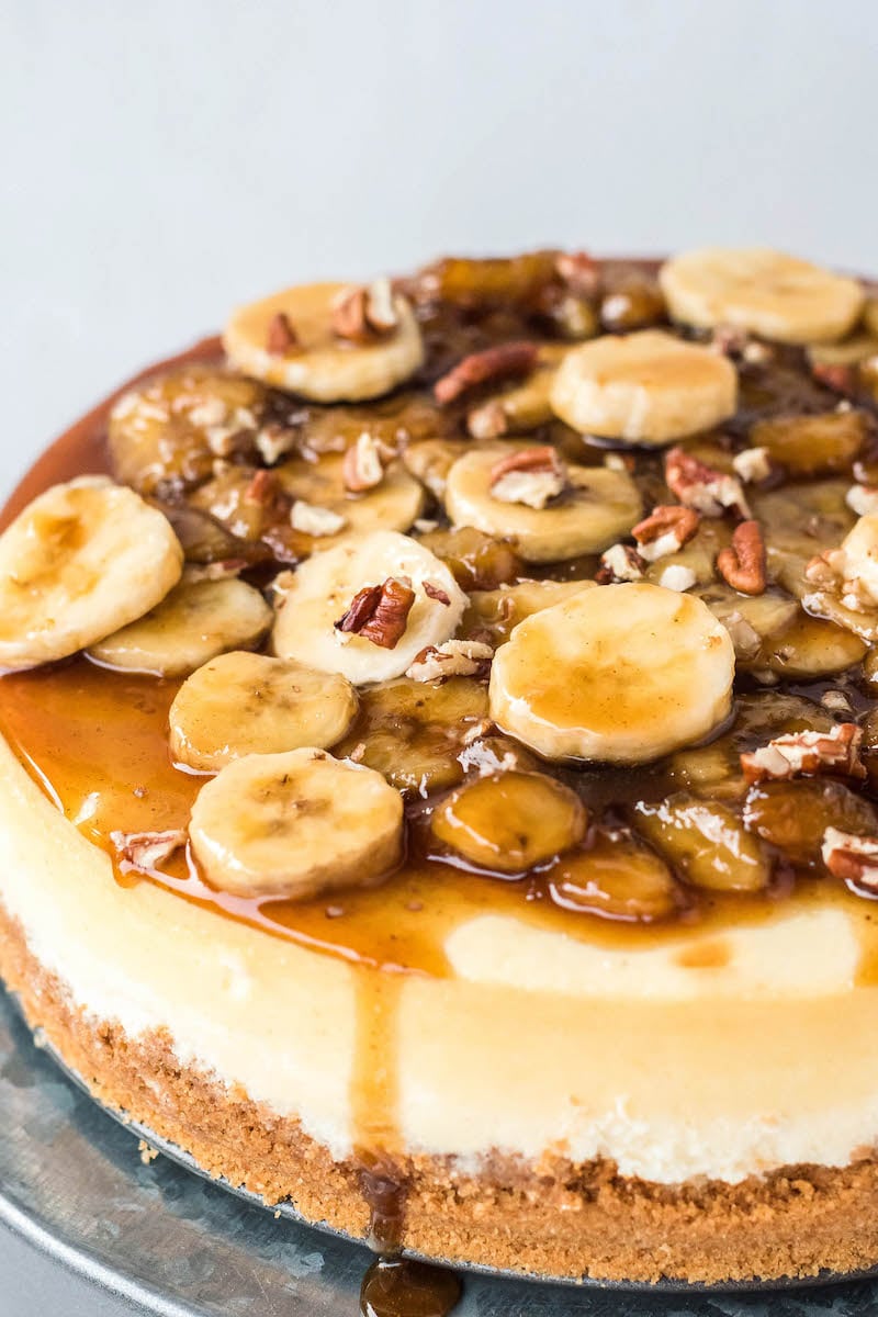 Bananas foster cheesecake topped with banana slices.
