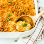 Cheesy potato casserole in a pan.