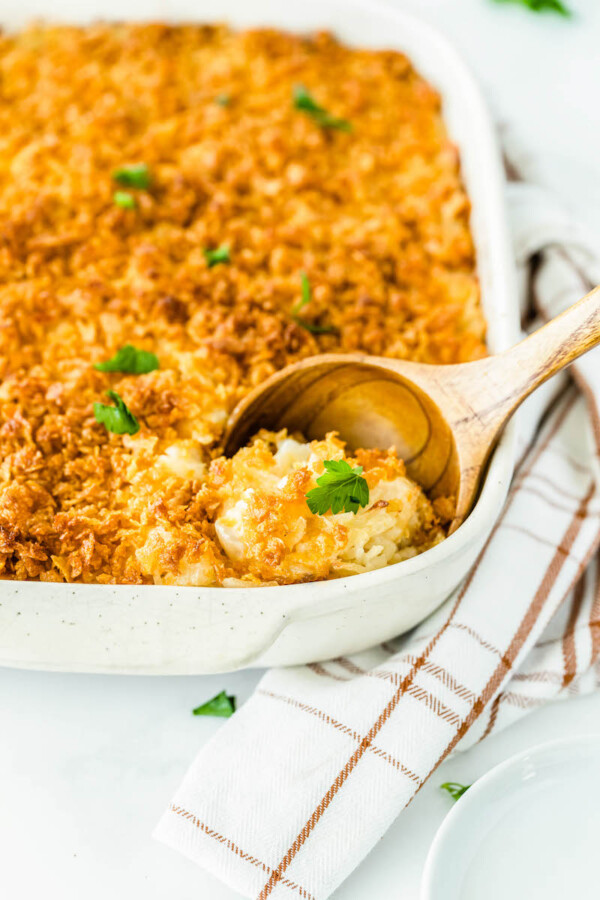 Cheesy potato casserole in a pan.