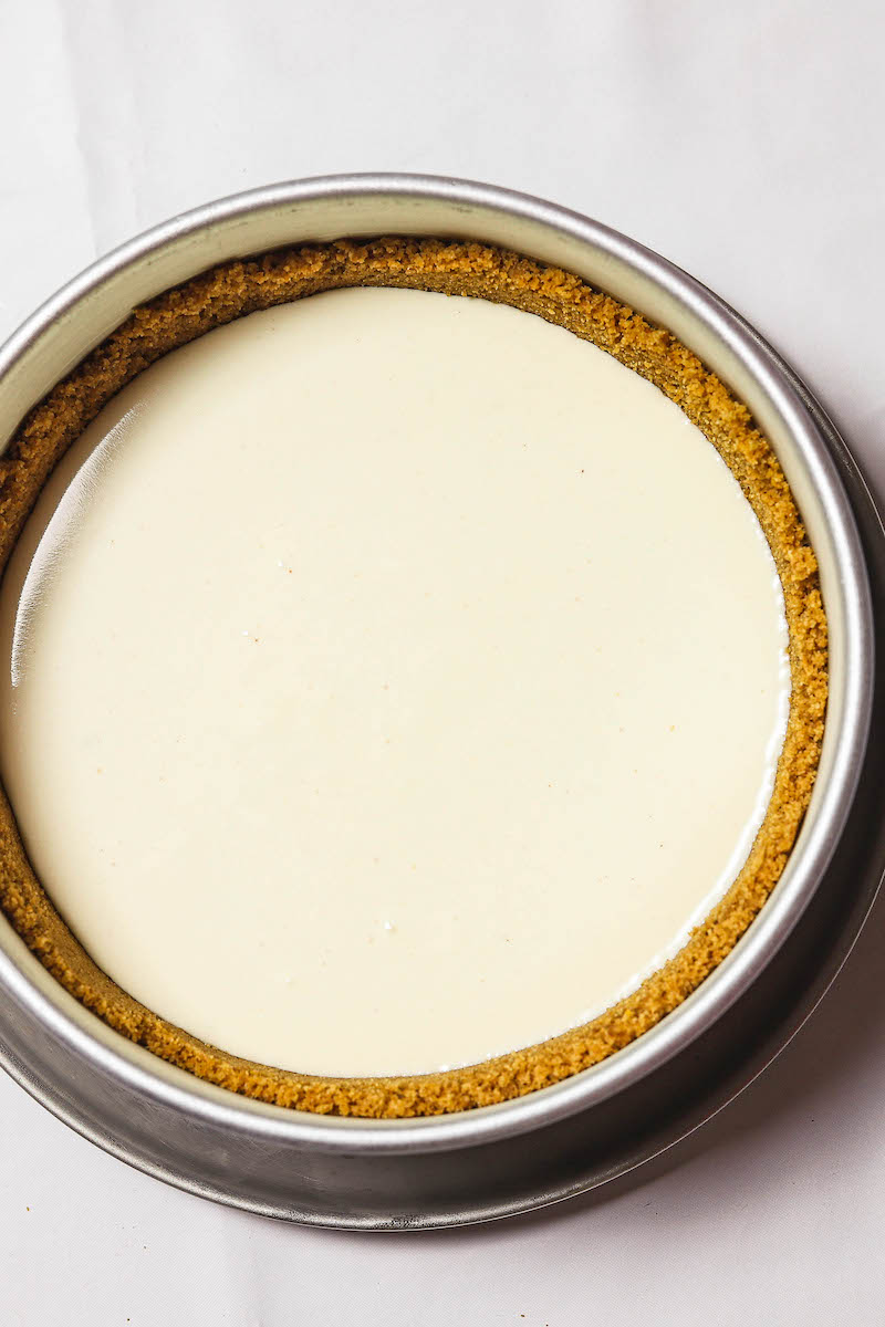 Unbaked cheesecake in a pan.