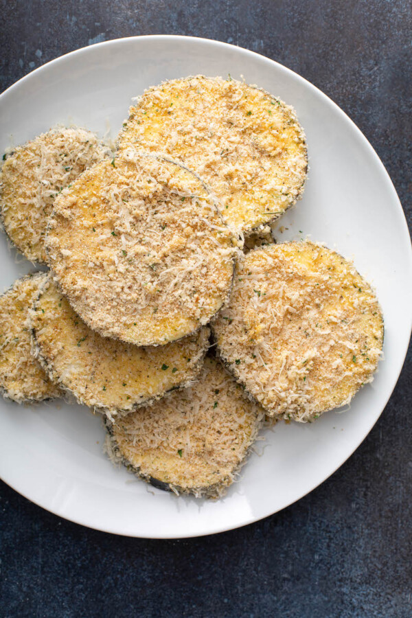 Eggplant slices are covered in bread crumbs