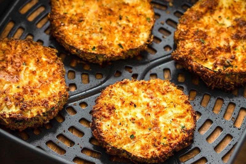 Golden-browned breaded eggplant slices in an air fryer