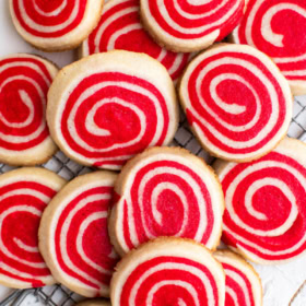 Overhead image of pinwheel cookies stacked on top of each other on marble.