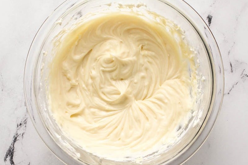 Cream cheese filling mixture in a mixing bowl
