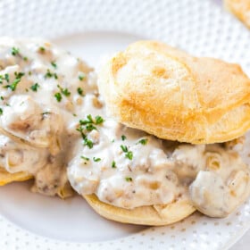 Two biscuits with sausage gravy.