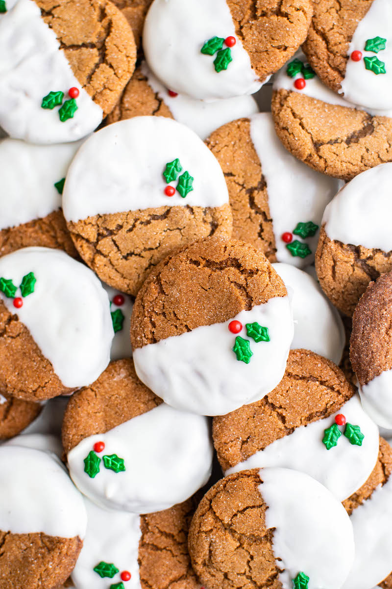 Pile of gingersnaps dipped in white chocolate.