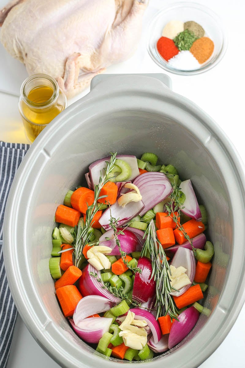 Chopped veggies in a crockpot.