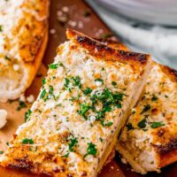 Slices of goat cheese garlic bread.