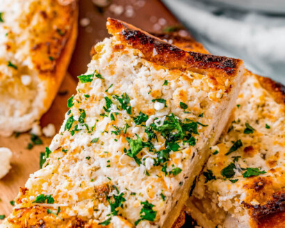 Slices of goat cheese garlic bread.