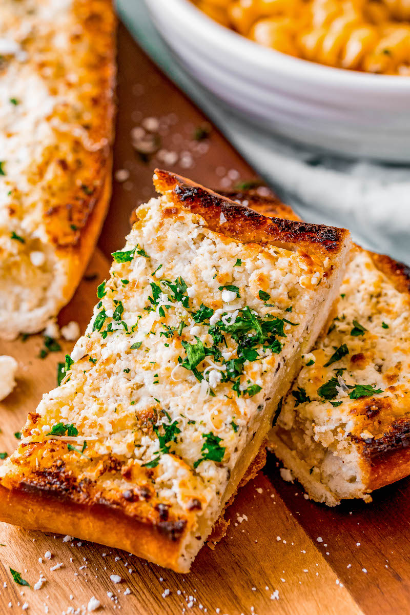 Slices of goat cheese garlic bread.