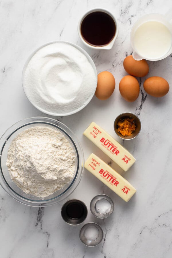 The ingredients for bundt cake are placed on a white surface. 