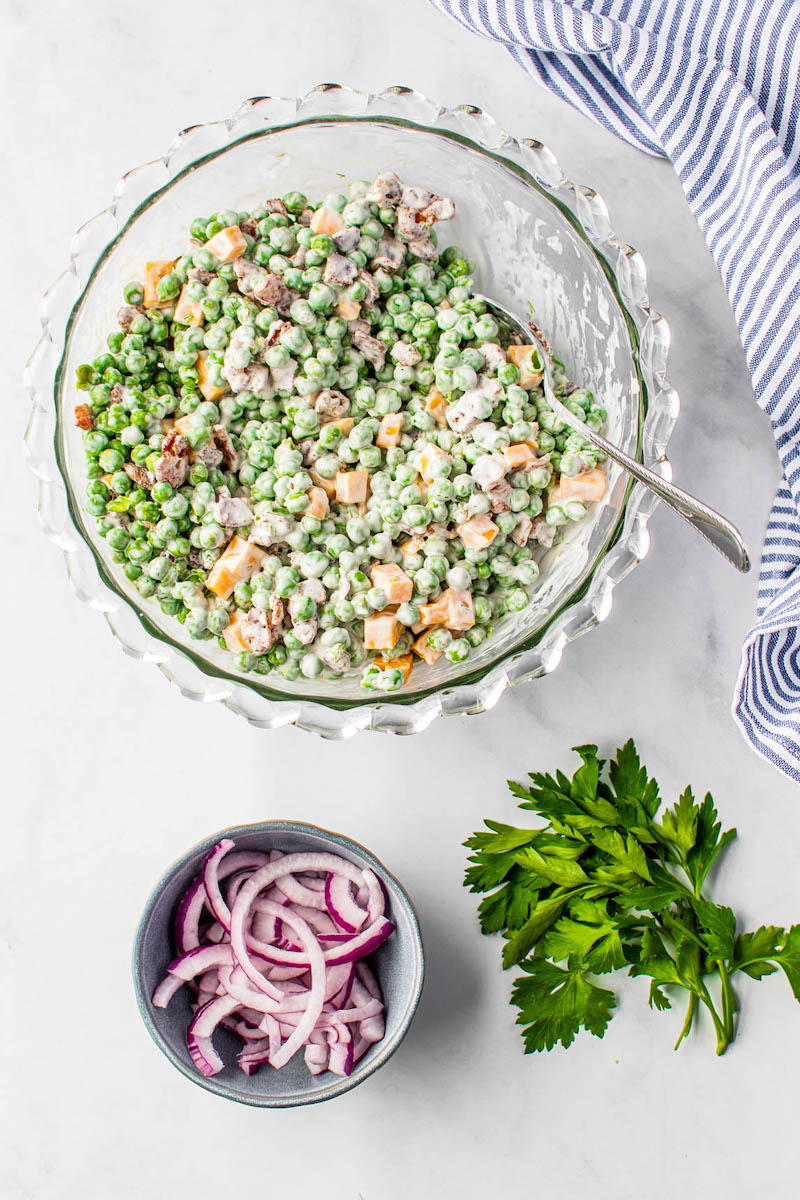 Loaded pea salad with mayonnaise dressing.