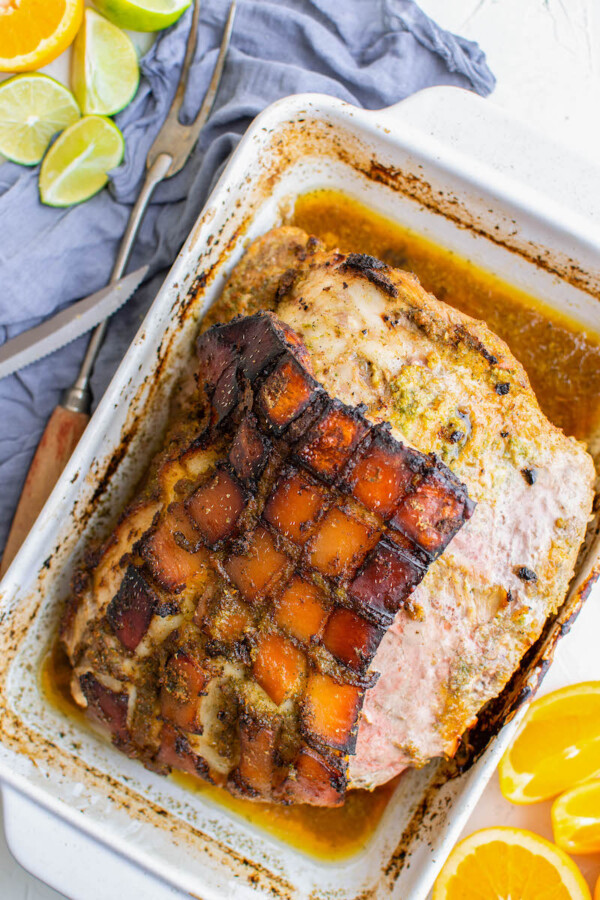 Fully cooked pernil is in the baking dish, ready to be served.